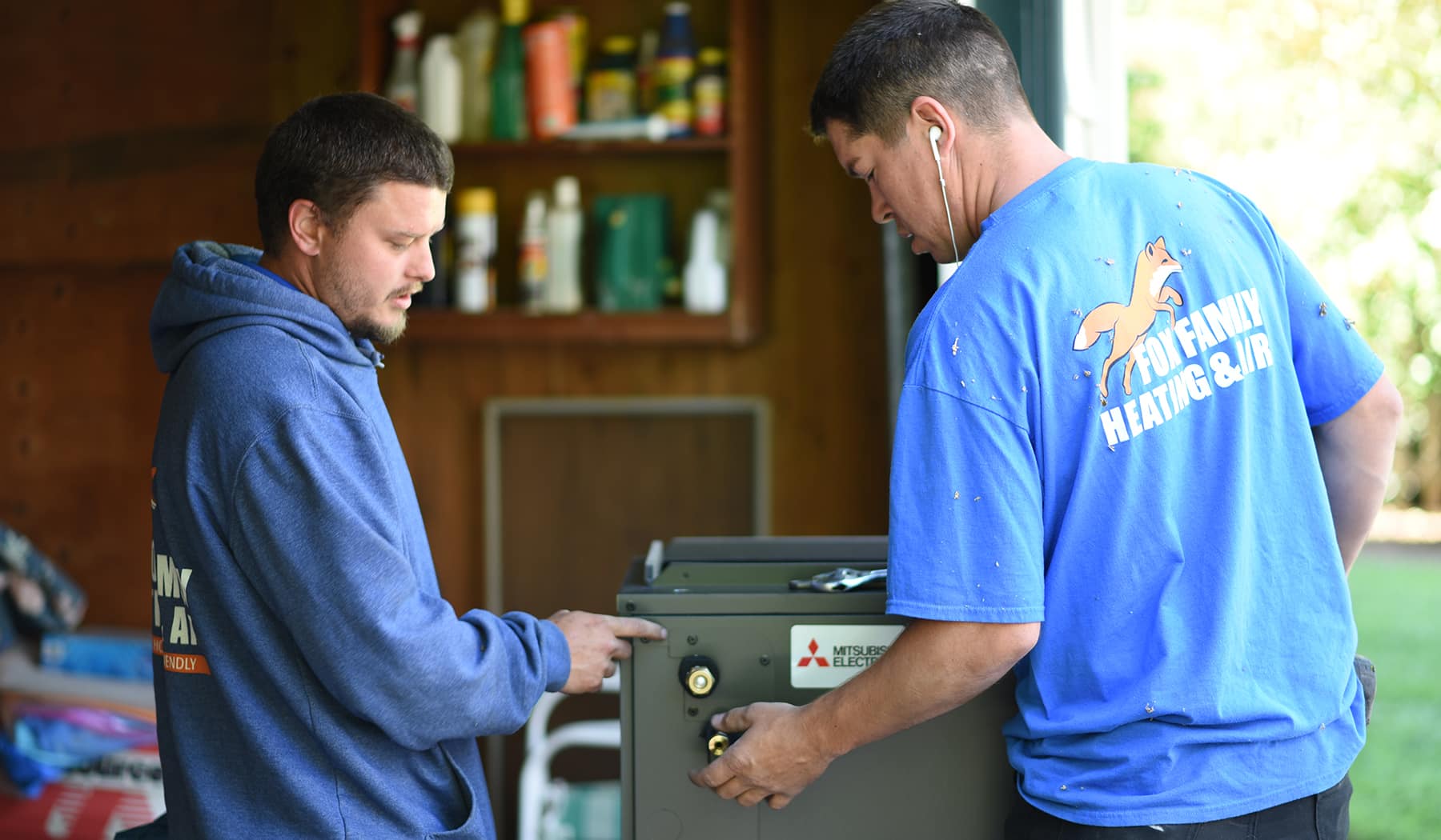 Technicians servicing an HVAC system in Sacramento.