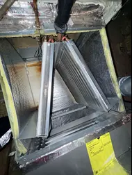 Indoor evaporator coil opened for AC cooling inspection at a Sacramento home