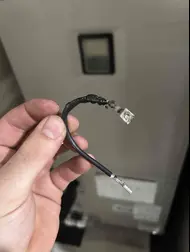 Technician identifying and repairing damaged AC wiring in Rancho Cordova